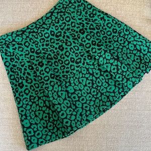 Green & black pleated, mini skirt.